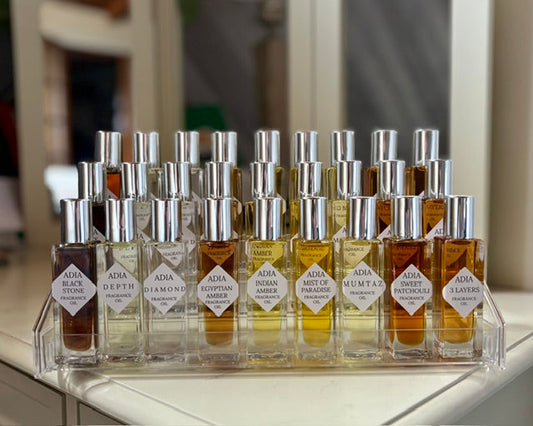 Featured in the picture are all of our current natural fragrance oils in our new square shaped, one ounce roll-on glass container. They have a beautiful silver screw on cap.