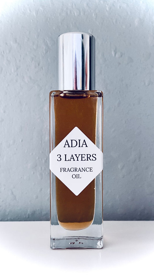 Travel-friendly natural fragrance oil in a square shaped roll-on bottle that has a a unique blend of rich amber oils and a crisp, clean essential oil blend.