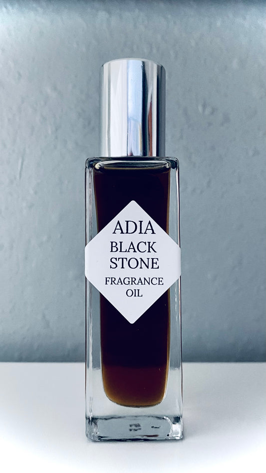 Travel-friendly natural fragrance oil in a square shaped roll-on bottle made with a clean essential oil blend that is deep, dark, and powerful.