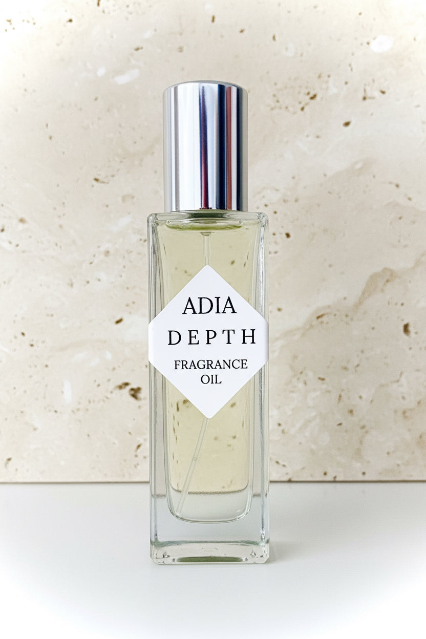 Travel-friendly natural fragrance oil in a square shaped roll-on bottle, made with light amber and a clean, masculine essential oil blend.