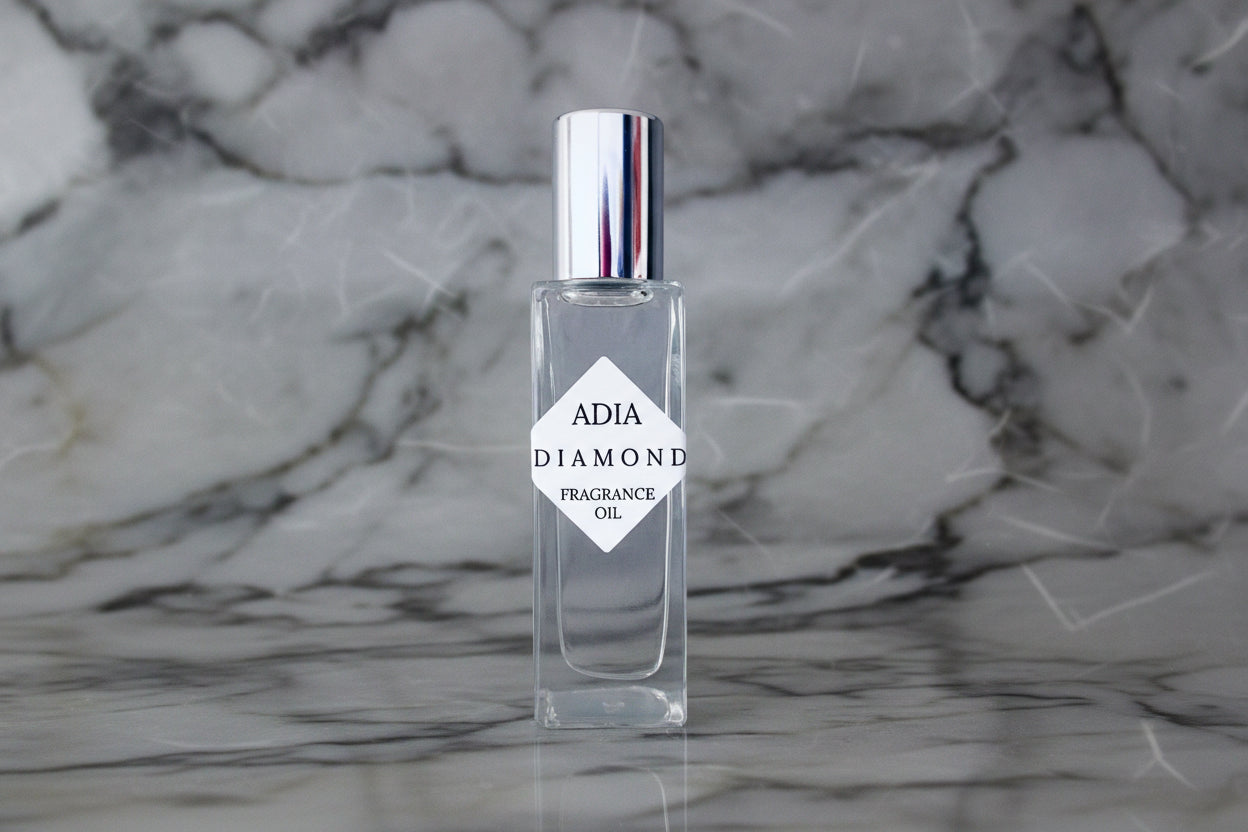 Travel-friendly natural fragrance oil in a square shaped, roll-on bottle that is delicate and refreshing with an alluring aura.