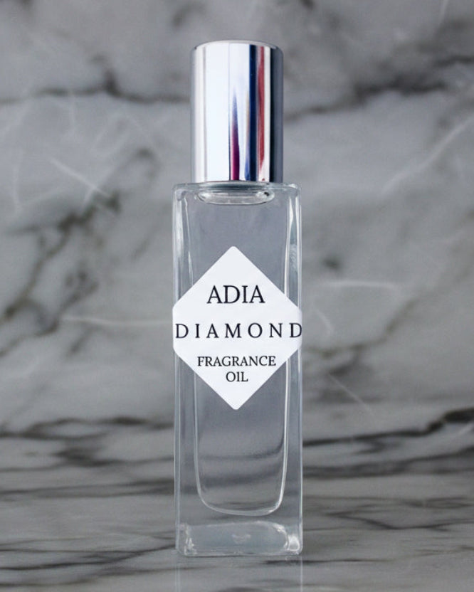 Travel-friendly natural fragrance oil in a square shaped, roll-on bottle that is delicate and refreshing with an alluring aura.